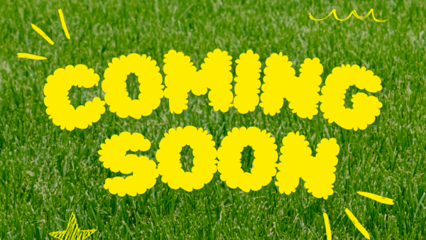 Ảnh nền bãi cỏ với dòng chữ Coming Soon
